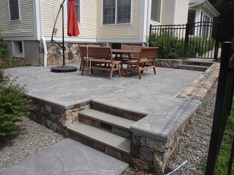 Completed stone wall project adding charm and structure to a home exterior